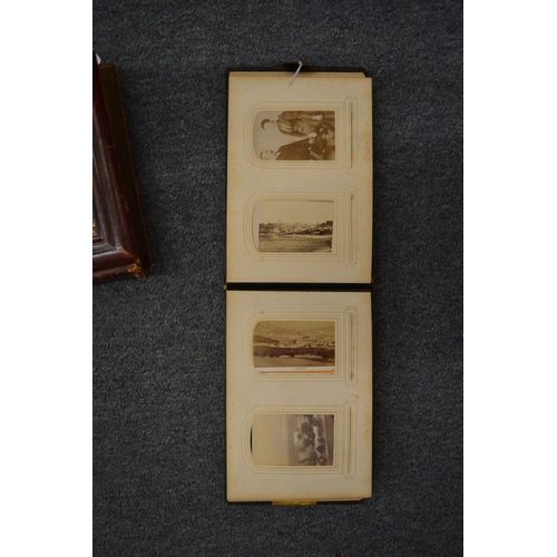 859 - Two Victorian embossed leather photograph albums with contents.