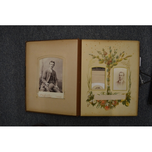 859 - Two Victorian embossed leather photograph albums with contents.