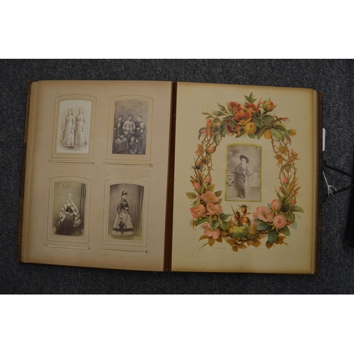 859 - Two Victorian embossed leather photograph albums with contents.