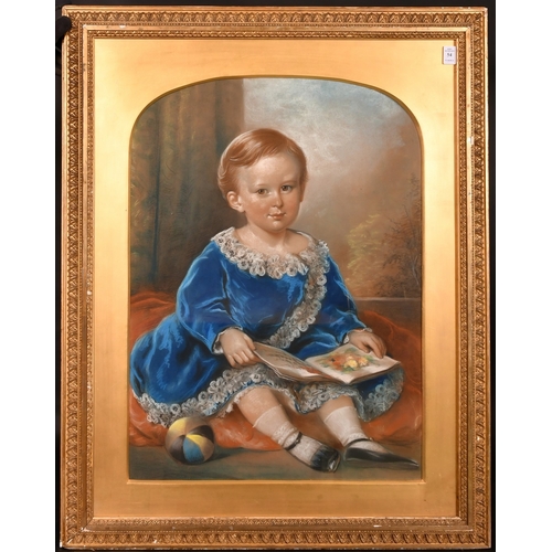 132 - 19th Century English School, a pastel portrait of a young child seated on a cushion holding a book, ... 