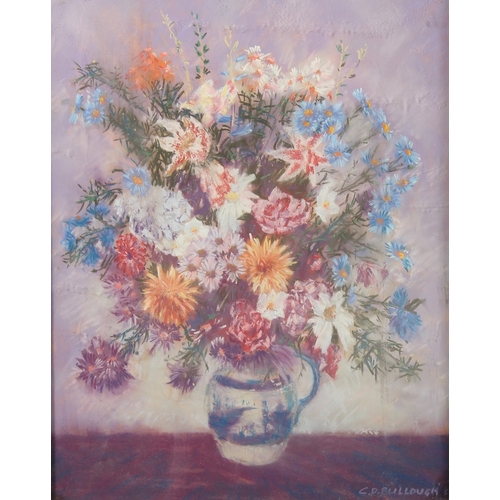 150 - C.D. Bullough, A still life of mixed flowers in a blue and white jug, pastel, signed, 14.5