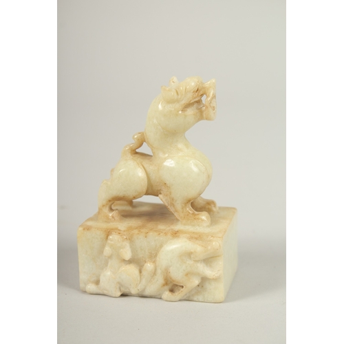 104 - A CHINESE JADE DOG OF FO SEAL. 9cms high.