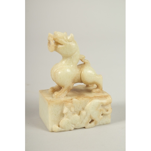 104 - A CHINESE JADE DOG OF FO SEAL. 9cms high.