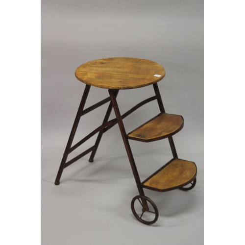 11 - A FLORIST DISPLAY STAND with metal wheels.