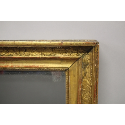 12 - A LARGE PERIOD GILT FRAME MIRROR. Mirrored panel 100cm x 80cm.