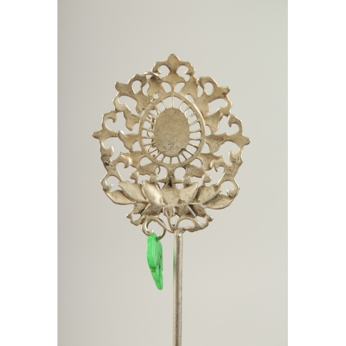 126 - A CHINESE SILVER AND JADE HAIR PIN.