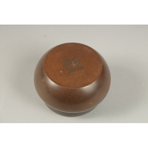 129 - A CHINESE CIRCULAR BRONZE CENSER AND COVER. 7cms.