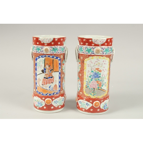 134 - A PAIR OF JAPANESE IMARI CIRCULAR VASES. 26cms high.