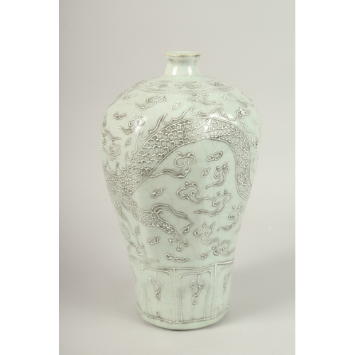 140 - A CHINESE CELADON GLAZE PORCELAIN MEIPING DRAGON VASE. 33cms high.