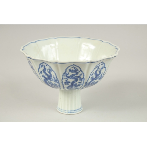 143 - A CHINESE BLUE AND WHITE DRAGON STEM CUP. 17cms diameter.