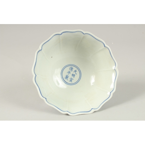 143 - A CHINESE BLUE AND WHITE DRAGON STEM CUP. 17cms diameter.