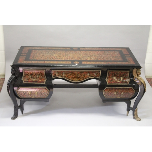 15 - A VERY LARGE LOUIS XIV STYLE DESK after a model by ANDRE-CHARLES BOULLE with brasss inlay on red tor... 