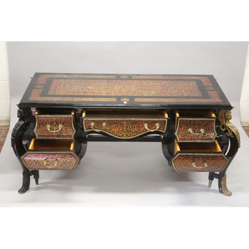 15 - A VERY LARGE LOUIS XIV STYLE DESK after a model by ANDRE-CHARLES BOULLE with brasss inlay on red tor... 