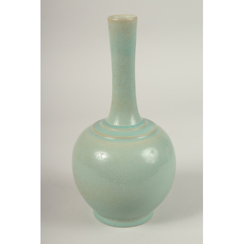 151 - A CHINESE CELADON TWIN-HANDLE CRACKLE GLAZE VASE. 28cms high.