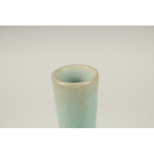 151 - A CHINESE CELADON TWIN-HANDLE CRACKLE GLAZE VASE. 28cms high.