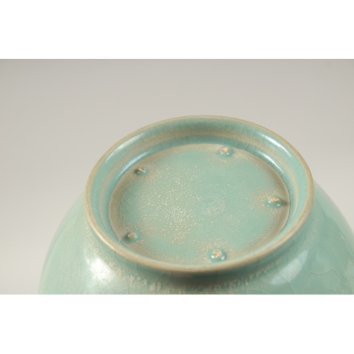 151 - A CHINESE CELADON TWIN-HANDLE CRACKLE GLAZE VASE. 28cms high.