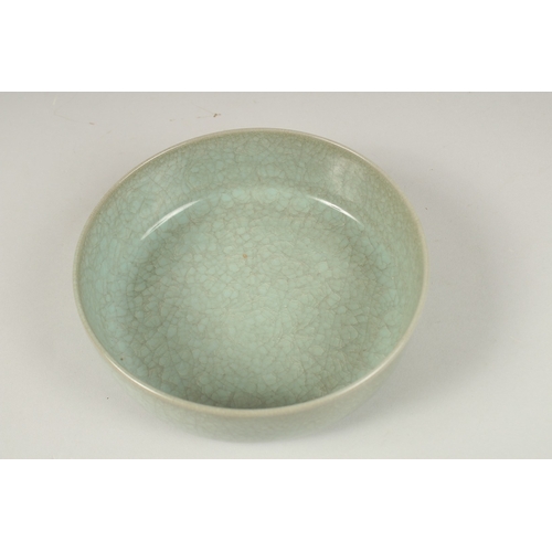 156 - A CHINESE CELADON BOWL. 16.5cms diameter.