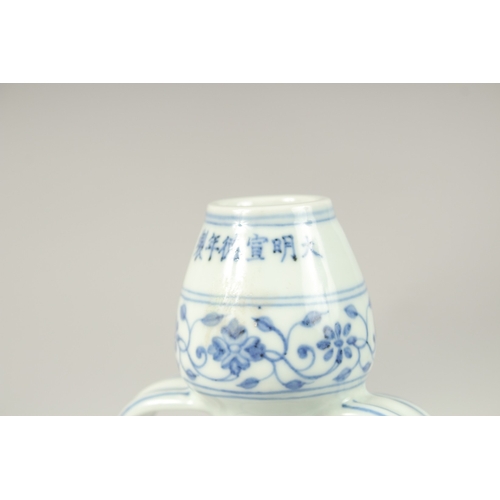 157 - A CHINESE BLUE AND WHITE TWIN-HANDLE MOON FLASK. 31cms high.