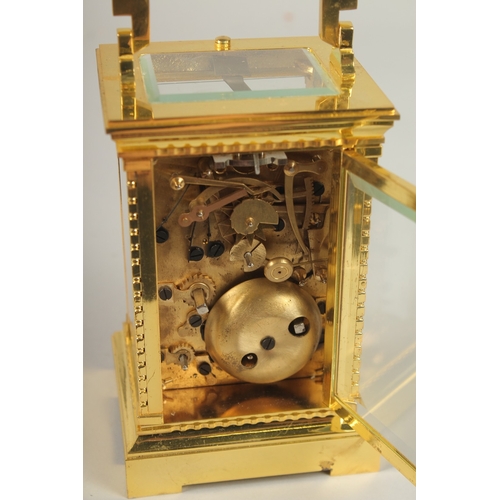 161 - A GOOD GILT BRONZE REPEATING CARRIAGE CLOCK with alarm. 14cms high.