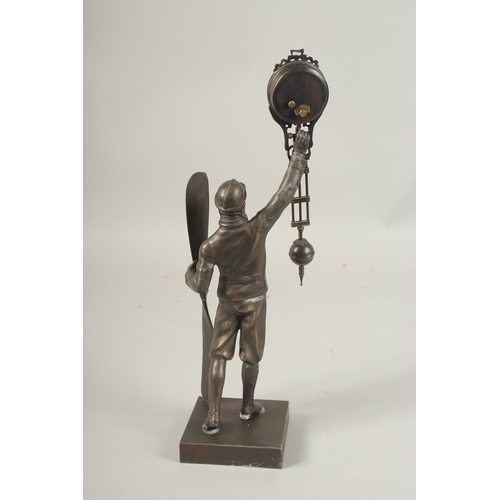 163 - AN AIRMAN BRONZED SWING CLOCK.
34cms high