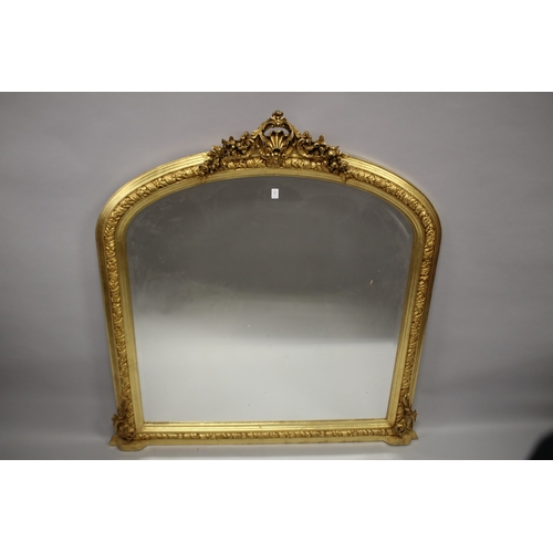 23 - A DECORATIVE 19TH CENTURY GILTWOOD OVERMANTLE MIRROR. 134cms high x 130cms wide.