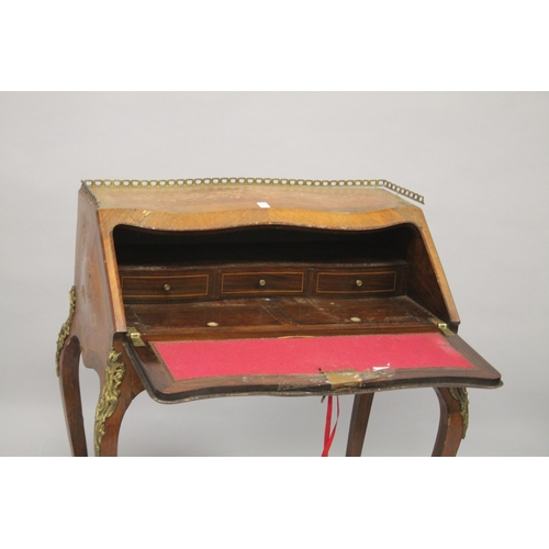 25 - A FRENCH STYLE MARQUETRY INLAID AND ORMOLU MOUNTED KINGWOOD BUREAU DE DAME. 96cms high x 77cms wide ... 