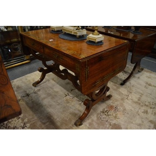 4 - A VERY GOOD REGENCY ROSEWOOD AND BRASS INLAID SOFA TABLE,with folding flaps. 122cms long.