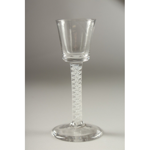 41 - A GEORGIAN WINE GLASS with plain bowl and white air twist stem. 15cms high.