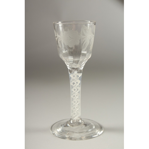 43 - A GEORGIAN WINE GLASS, the bowl engraved with roses, with air twist stem. 15cms high, three tiny chi... 