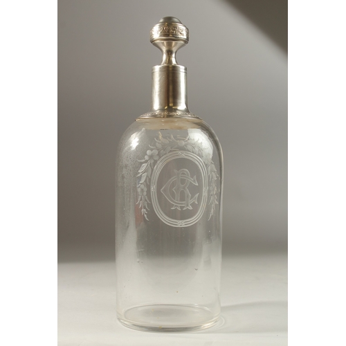 50 - A GOOD CONTINENTAL GLASS DECANTER. engraved CR in a shell, with silver mount and stopper. 28cms high... 