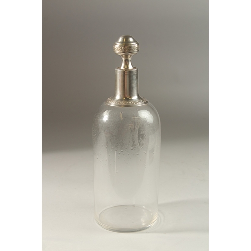 50 - A GOOD CONTINENTAL GLASS DECANTER. engraved CR in a shell, with silver mount and stopper. 28cms high... 