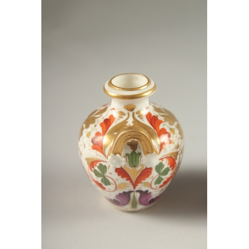 62 - A GARNITURE OF FOUR SMALL PIECES OF CROWN DERBY, scent bottle & stopper and three small vases. Mark ... 