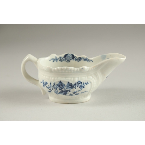 67 - A SMALL LOWESTOFT BLUE AND WHITE SAUCEBOAT. Circa. 1771.  11cms.