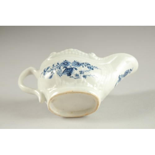 67 - A SMALL LOWESTOFT BLUE AND WHITE SAUCEBOAT. Circa. 1771.  11cms.