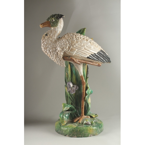 69 - A MINTON FLOWER VASE, in the form of a heron modelled by John Henk. Circa. 1880.  65cms high.  Mark ... 