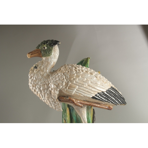 69 - A MINTON FLOWER VASE, in the form of a heron modelled by John Henk. Circa. 1880.  65cms high.  Mark ... 