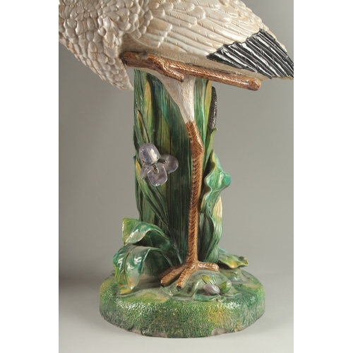 69 - A MINTON FLOWER VASE, in the form of a heron modelled by John Henk. Circa. 1880.  65cms high.  Mark ... 