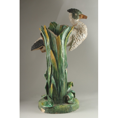 69 - A MINTON FLOWER VASE, in the form of a heron modelled by John Henk. Circa. 1880.  65cms high.  Mark ... 