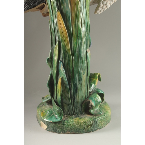 69 - A MINTON FLOWER VASE, in the form of a heron modelled by John Henk. Circa. 1880.  65cms high.  Mark ... 