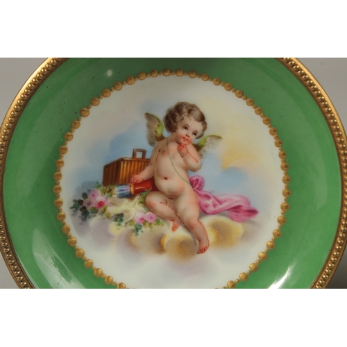 71 - A GOOD PAIR OF SEVRES APPLE GREEN PORCELAIN CIRCULAR TAZZAS painted with cupids, the ormolu bases wi... 