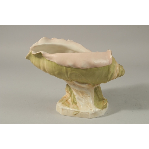 74 - A ROYAL DUX PORCELAIN SHAPED BOWL held by a young lady. 17cms high. Triangle mark No. 1117.