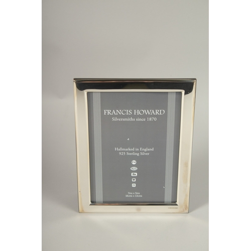 746 - A HALLMARKED STERLING SILVER PHOTOGRAPH FRAME. 18cms x 13cms.