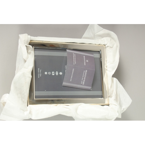 746 - A HALLMARKED STERLING SILVER PHOTOGRAPH FRAME. 18cms x 13cms.