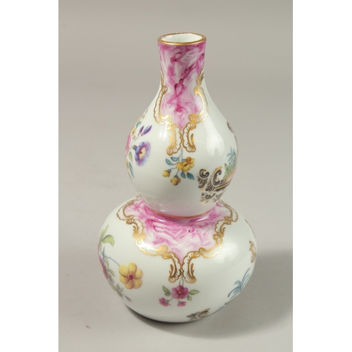 78 - A GOOD FRENCH PORCELAIN DOUBLE GOURD VASE painted with Turkish scenes and flowers. 20cms high.