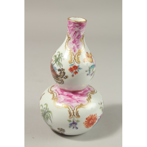 78 - A GOOD FRENCH PORCELAIN DOUBLE GOURD VASE painted with Turkish scenes and flowers. 20cms high.