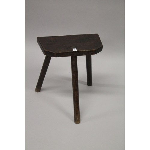 8 - A CUTLERS WOODEN THREE LEGGED STOOL stamped 