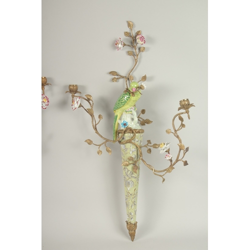 85 - A GOOD PAIR OF GILT METAL AND PORCELAIN WALL SCONCES with two candle sconces, flowers and birds. 80c... 