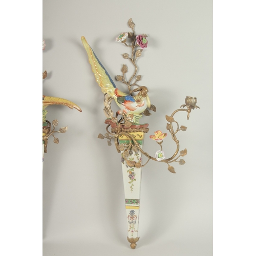 86 - A GOOD PAIR OF GILT METAL AND PORCELAIN PHEASANTS WALL SCONCES with two candle sconces, flowers and ... 