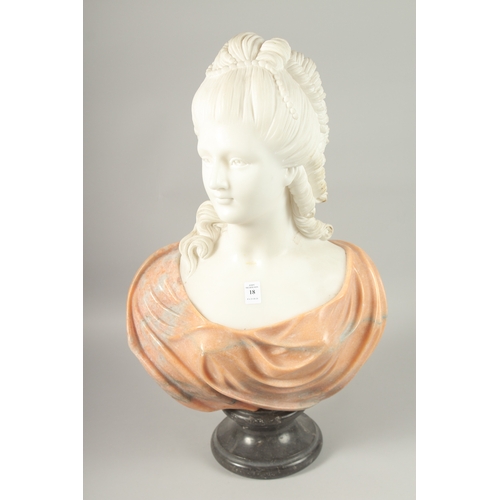 18 - A GOOD CARVED TWO COLOUR MARBLE BUST OF A LADY, on a circular base. 64cm high.