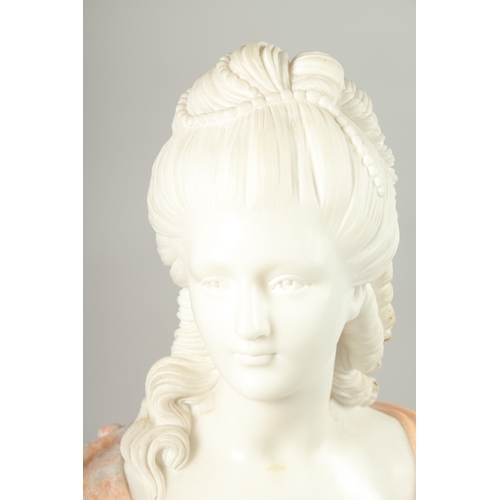 18 - A GOOD CARVED TWO COLOUR MARBLE BUST OF A LADY, on a circular base. 64cm high.